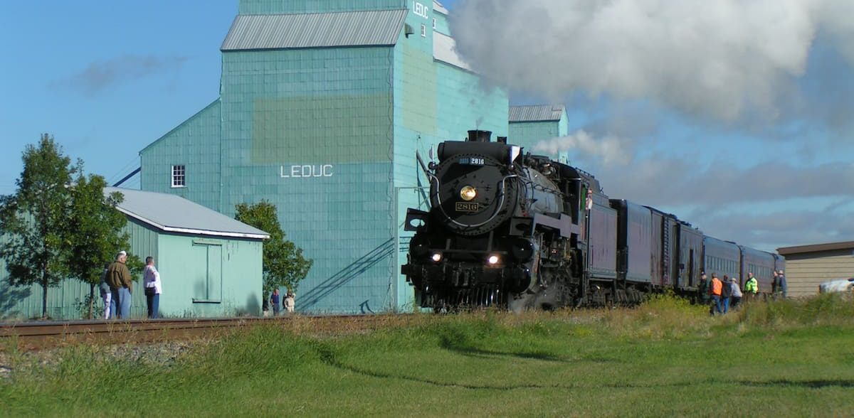 Leduc, Alberta — historic steam train passing the Leduc grain elevator