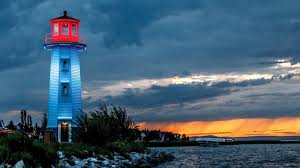 Sylvan Lake, Alberta — illuminated lighthouse at sunset on the lakefront